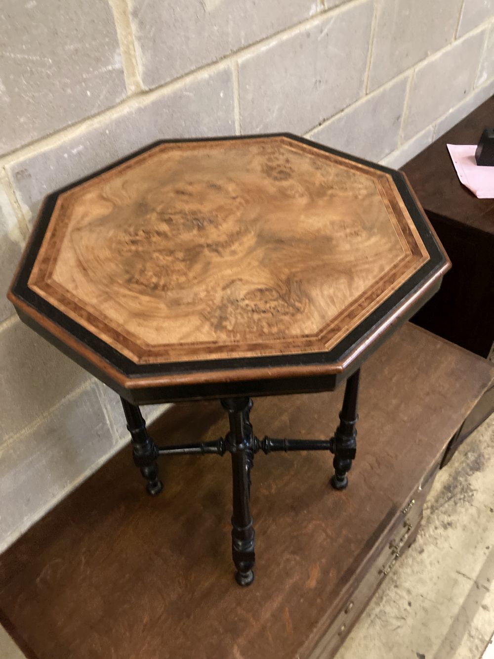 A late Victorian amboyna banded octagonal ebonised and walnut occasional table, width 49cm, depth 49cm, height 64cm